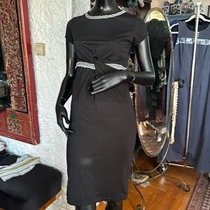 Twist front stretch black cocktail dress with recycled denim trim